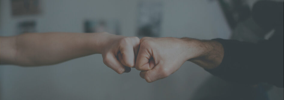 Fist bump - symbolic two fist hand and fingers